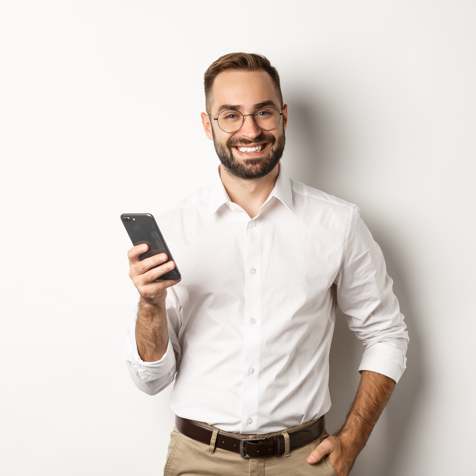 handsome-manager-using-smartphone-smiling-pleased-sending-text-message-standing-white-backg_1570x1570.jpg