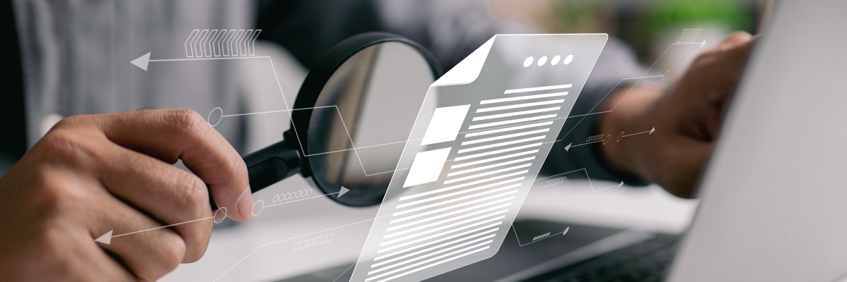 man-inspecting-paperwork-with-magnifier-business-analysis-concept_1200x400.jpg