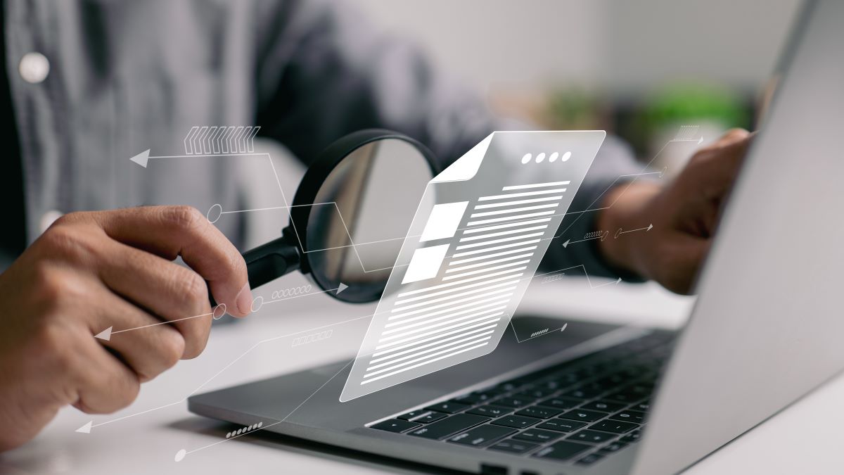 man-inspecting-paperwork-with-magnifier-business-analysis-concept_1200x675.jpg